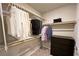 A well-organized walk-in closet with shelving and hanging rods for ample storage at 9648 Spyglass Run Ave, Las Vegas, NV 89178