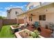 Spacious outdoor patio area with a grill, cooking equipment, and an inviting seating area at 10164 Village Breeze Pl, Las Vegas, NV 89183