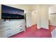 Bedroom featuring a television and a view of a closet and a bathroom at 10164 Village Breeze Pl, Las Vegas, NV 89183