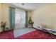 Bright bedroom featuring artwork on display and a large window at 10164 Village Breeze Pl, Las Vegas, NV 89183