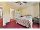 Bedroom with a comfortable bed, storage, and access to the en-suite bathroom at 10164 Village Breeze Pl, Las Vegas, NV 89183