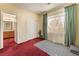 Spacious bedroom with a closet and a bathroom through the doorway at 10164 Village Breeze Pl, Las Vegas, NV 89183