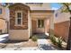 Charming home featuring a porch with columns and a well-maintained front yard at 10164 Village Breeze Pl, Las Vegas, NV 89183