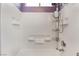 Shower/bathtub with white tile and an adjustable shower head with a corner caddy at 10164 Village Breeze Pl, Las Vegas, NV 89183