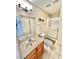 Bathroom featuring a single sink, framed mirror, and walk-in shower with glass doors at 10500 Horseshoe Falls Ct, Las Vegas, NV 89144
