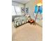 Cozy bedroom with natural light, a single bed and simple decor at 10500 Horseshoe Falls Ct, Las Vegas, NV 89144