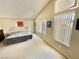 Bright bedroom with neutral walls, vaulted ceilings, and large windows at 10500 Horseshoe Falls Ct, Las Vegas, NV 89144