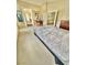 Bright bedroom with neutral carpet, walk-in closet, and adjacent bathroom at 10500 Horseshoe Falls Ct, Las Vegas, NV 89144