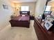 Bedroom with a large bed, antique dresser, and area rug at 10500 Horseshoe Falls Ct, Las Vegas, NV 89144