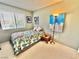 Bright bedroom with natural light, a single bed and simple decor at 10500 Horseshoe Falls Ct, Las Vegas, NV 89144