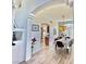 Bright dining room featuring an arched doorway and a stylish chandelier above the dining table at 10500 Horseshoe Falls Ct, Las Vegas, NV 89144