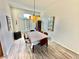 Charming dining area with vaulted ceiling, complemented by stylish lighting and elegant decor at 10500 Horseshoe Falls Ct, Las Vegas, NV 89144