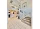 Bright foyer featuring high ceilings, decorative art, and staircase at 10500 Horseshoe Falls Ct, Las Vegas, NV 89144