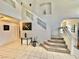 Open foyer with tiled floors and staircase leading to upper level at 10500 Horseshoe Falls Ct, Las Vegas, NV 89144