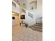 Bright foyer featuring high ceilings, decorative art, and staircase at 10500 Horseshoe Falls Ct, Las Vegas, NV 89144