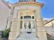 Inviting front porch with decorative columns and a double-door entrance at 10500 Horseshoe Falls Ct, Las Vegas, NV 89144