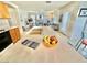 The kitchen features an island with a sink, perfect for food prep and entertaining with easy access to the living room at 10500 Horseshoe Falls Ct, Las Vegas, NV 89144