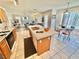 Well-appointed kitchen opens to a cozy living area with a fireplace, creating an inviting atmosphere at 10500 Horseshoe Falls Ct, Las Vegas, NV 89144