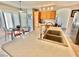 Well-lit kitchen featuring wooden cabinetry, a practical sink and an adjacent eat-in dining area at 10500 Horseshoe Falls Ct, Las Vegas, NV 89144