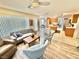 Bright open-concept living room with hardwood floors connecting to the kitchen at 10500 Horseshoe Falls Ct, Las Vegas, NV 89144