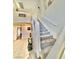 Carpeted staircase leading to the second floor with an adjacent open foyer at 10500 Horseshoe Falls Ct, Las Vegas, NV 89144