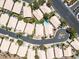 Aerial view of a neighborhood with single-story homes, tile roofs, desert landscaping, and community pool at 110 Eagleview Ct, Henderson, NV 89074