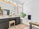 Modern bathroom featuring double vanity, bright lighting, and a glass-enclosed shower at 110 Eagleview Ct, Henderson, NV 89074