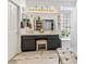 Bright bathroom featuring a double sink vanity, a glass block window, and neutral toned rugs at 110 Eagleview Ct, Henderson, NV 89074