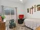 Cozy bedroom featuring a large window for natural light, complemented by stylish decor and soft carpeting at 110 Eagleview Ct, Henderson, NV 89074