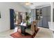 Bright dining room with garden view and built-in grey cabinetry for added storage at 110 Eagleview Ct, Henderson, NV 89074