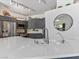 Modern kitchen with stainless steel appliances, gray cabinets, and quartz countertops at 110 Eagleview Ct, Henderson, NV 89074