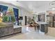 Open-concept living room and kitchen with an island bar and lots of natural light at 110 Eagleview Ct, Henderson, NV 89074