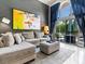 Cozy living room with a large window offering a view of the backyard and pool at 110 Eagleview Ct, Henderson, NV 89074