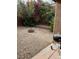 Backyard featuring decorative rocks and a built-in fire pit at 11173 Hickory Glen St, Las Vegas, NV 89179