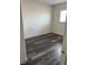 An empty room with wood-look flooring and a window with white blinds at 11173 Hickory Glen St, Las Vegas, NV 89179