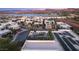 Modern home features a rooftop patio with seating, solar panels and beautiful neighborhood views at 12 Desert Lake Ln, Henderson, NV 89011
