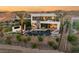 Expansive backyard featuring a pool, spa, fire pit and lots of seating, set against a stunning mountain backdrop at 12 Desert Lake Ln, Henderson, NV 89011