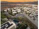 Aerial view showcasing modern homes, community pool, and lush landscaping in an exclusive community at 12 Desert Lake Ln, Henderson, NV 89011