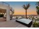 Stunning outdoor living with a unique fire pit and spiral staircase and a gorgeous desert backdrop at 12 Desert Lake Ln, Henderson, NV 89011