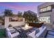 Cozy outdoor area features a fire pit, TV, and spa, perfect for relaxing evenings with friends and Gathering at 12 Desert Lake Ln, Henderson, NV 89011