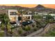 Stunning backyard with pool, spa, lounge area, spiral staircase and mountain views beyond at 12 Desert Lake Ln, Henderson, NV 89011