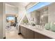 Bathroom features a double sink vanity, large mirror, and natural light from the clerestory window at 12 Desert Lake Ln, Henderson, NV 89011