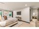 Spacious bedroom with light wood floors, sitting area, and ensuite bathroom at 12 Desert Lake Ln, Henderson, NV 89011