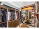 Custom closet with wooden shelving, drawers, and illuminated display areas at 12 Desert Lake Ln, Henderson, NV 89011