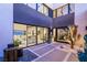 Contemporary courtyard with desert landscaping and water feature leading to the home's entrance at 12 Desert Lake Ln, Henderson, NV 89011