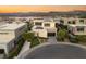 Modern home exterior with landscaped front yard, solar panels, and clean lines in a quiet neighborhood at 12 Desert Lake Ln, Henderson, NV 89011