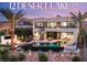 Stunning home featuring a luxurious pool, spa, fire pit, spiral staircase, and desert landscaping under a colorful sky at 12 Desert Lake Ln, Henderson, NV 89011