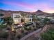 Modern two-story home with a pool, hot tub, fire pit, and desert landscaping at 12 Desert Lake Ln, Henderson, NV 89011