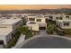Aerial view of a contemporary home with modern architecture and manicured landscaping in a luxury community at 12 Desert Lake Ln, Henderson, NV 89011