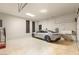 Spacious garage featuring high ceilings, sealed floor, and modern electric car charging station at 12 Desert Lake Ln, Henderson, NV 89011